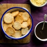 papdi for chaat, sev, dates tamarind chutney on a purple background.