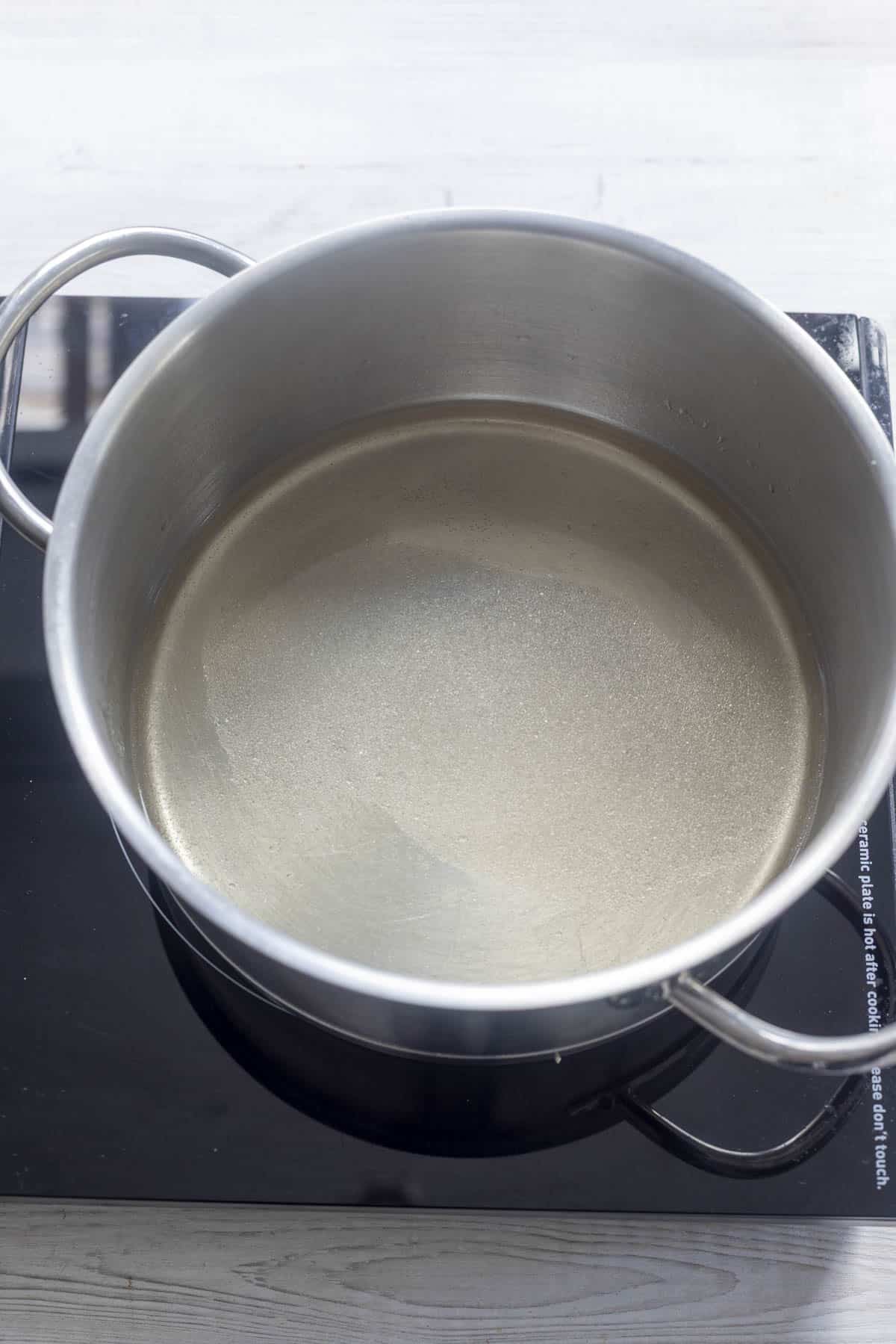 vinegar and sugar in a stainless steel pan.