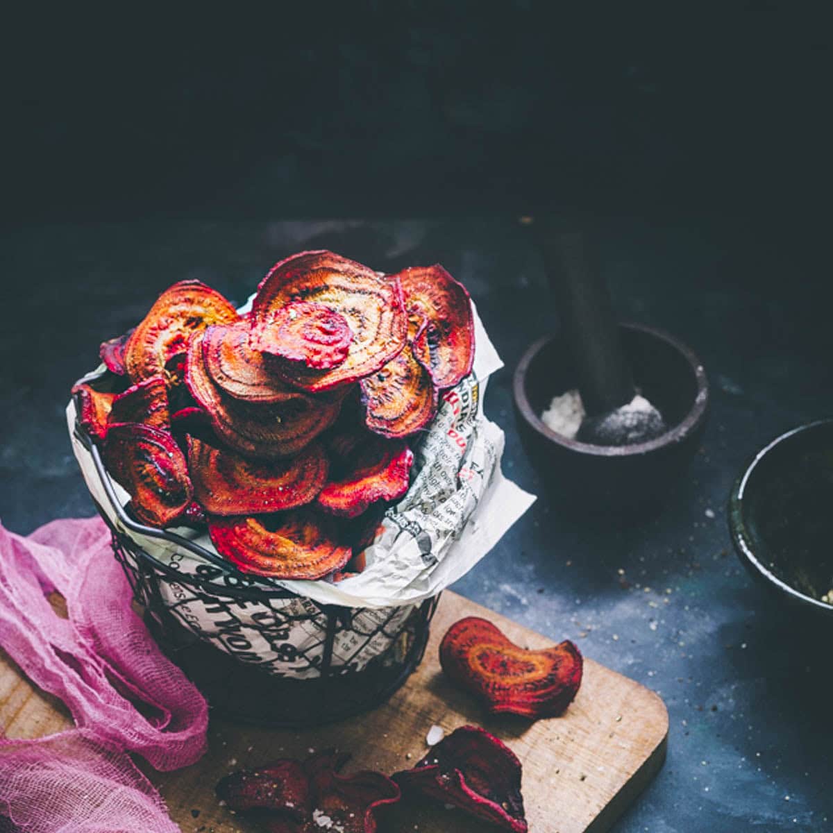 air fryer beetroot chips in wire basket.