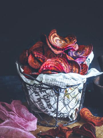 crispy beet chips made in air fryer in a wire serving basket.