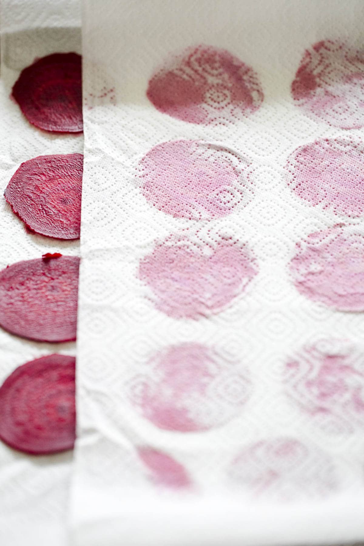 drying the beet slices between two kitchen towels.
