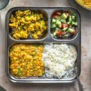 dal fry served with rice, cauliflower and kachumber salad