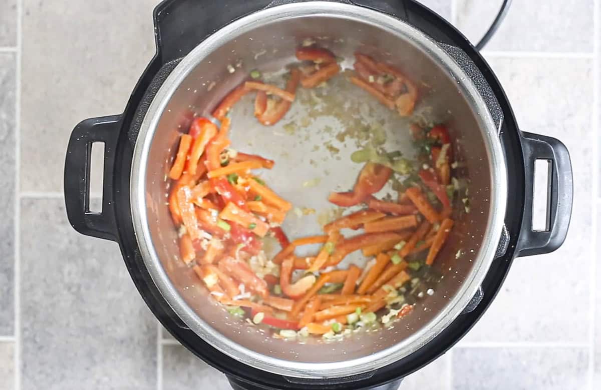 sautéed veggies in Instant Pot to make Thai peanut noodles.