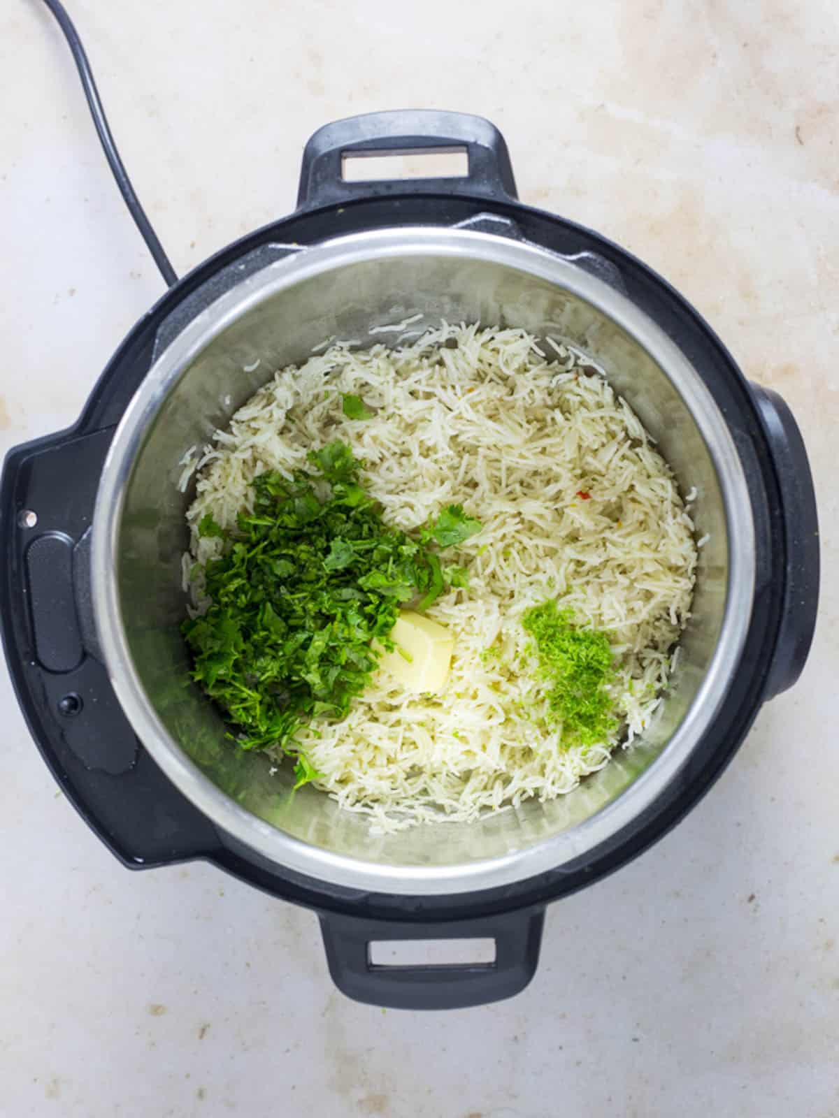 cilantro, lime, butter on top of fluffed rice in instant pot.