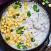 boondi raita served in a bowl with crunchy boondi, fresh coriander.