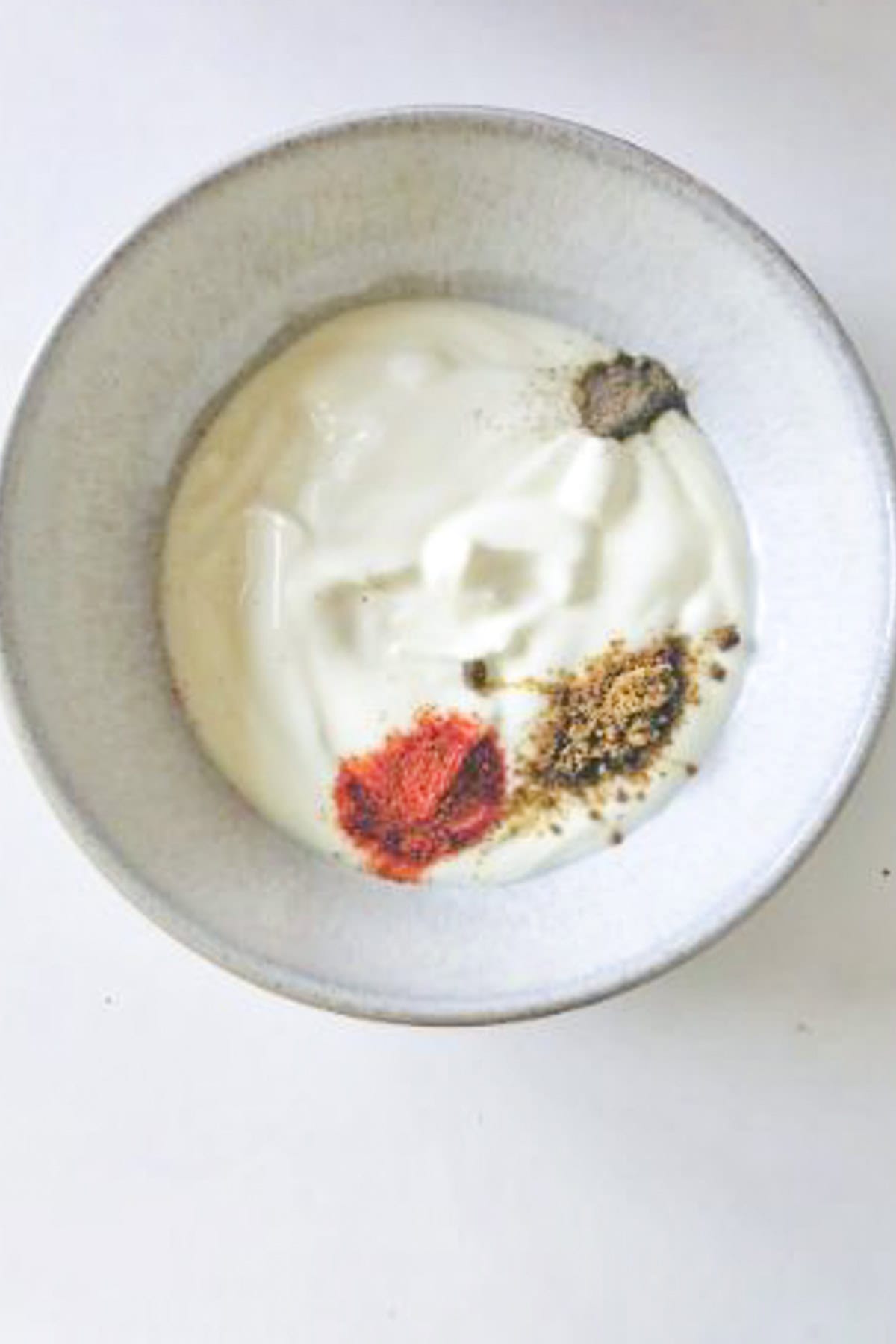 yogurt and spices in a bowl.
