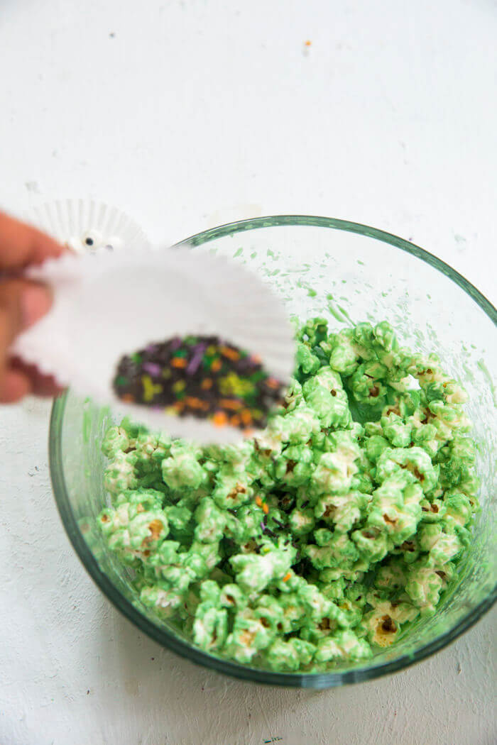 add sprinkles to halloween popcorn.