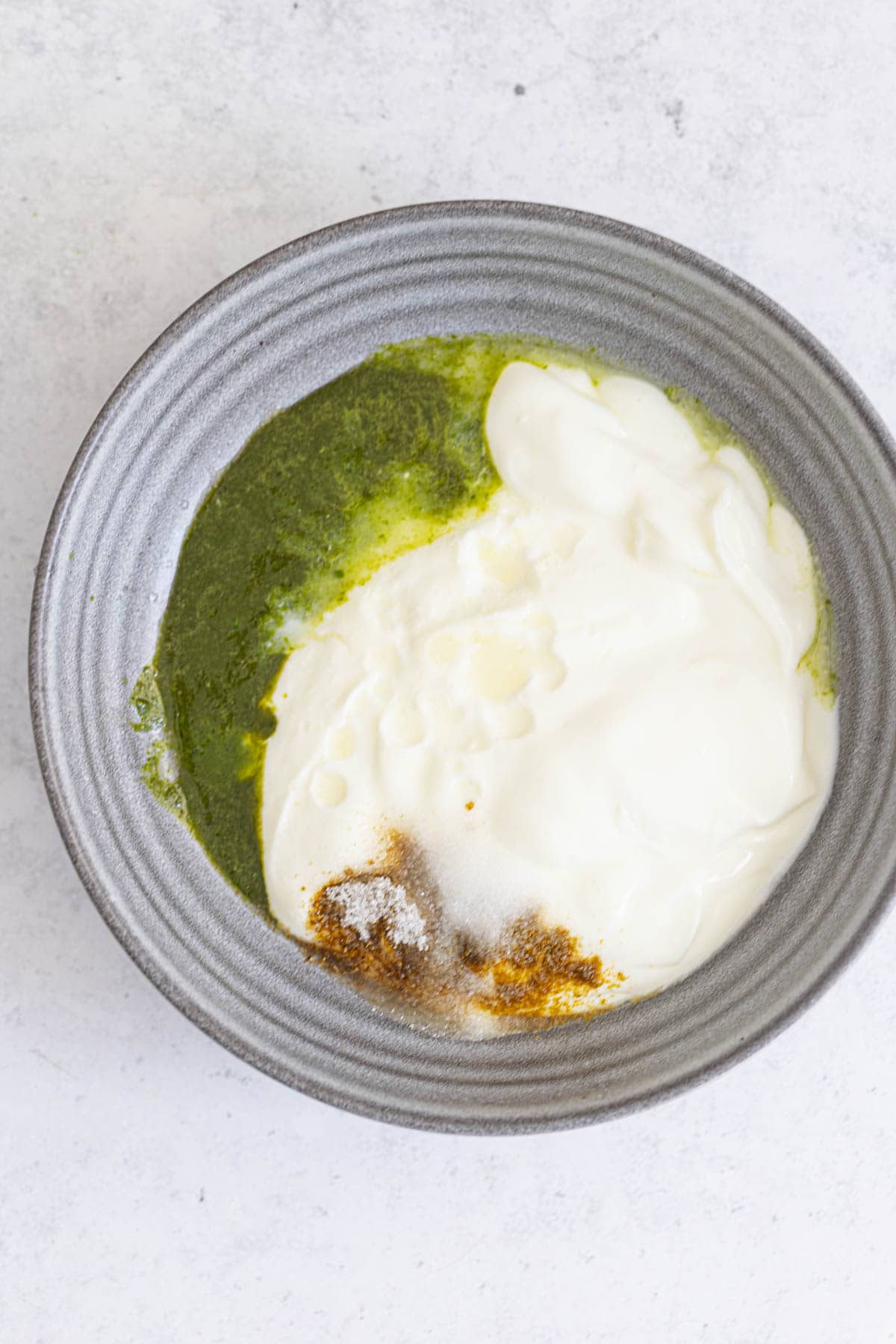 indian mint sauce ingredients in a grey bowl.