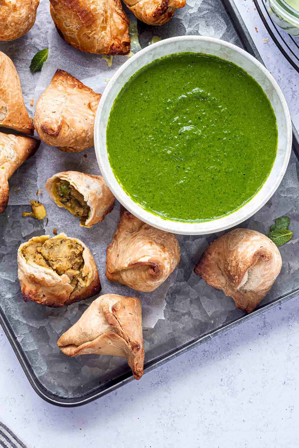 Indian mint coriander chutney served with samosas