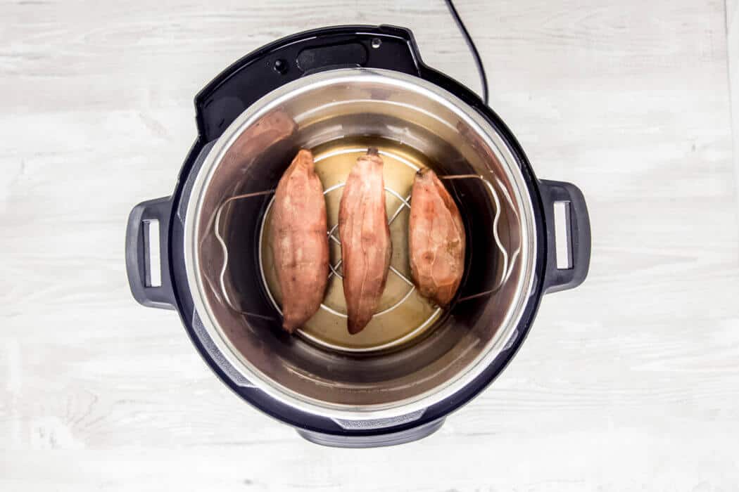 perfectly cooked sweet potatoes in the Instant Pot inner pot.