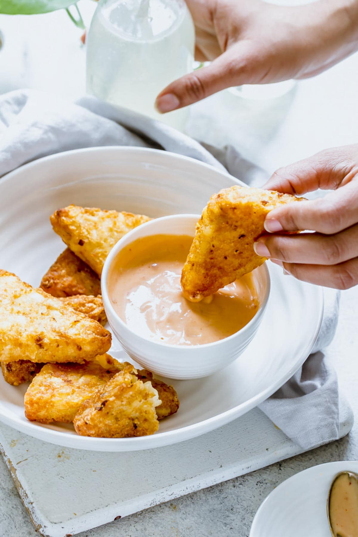 hash browns served with mayonnaise based boom boom sauce.