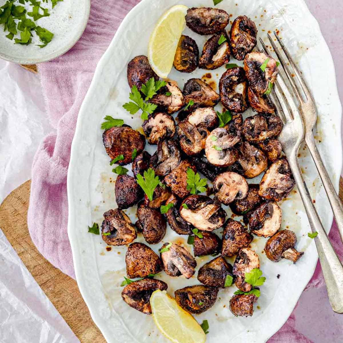 roasted mushrooms in a white platter.
