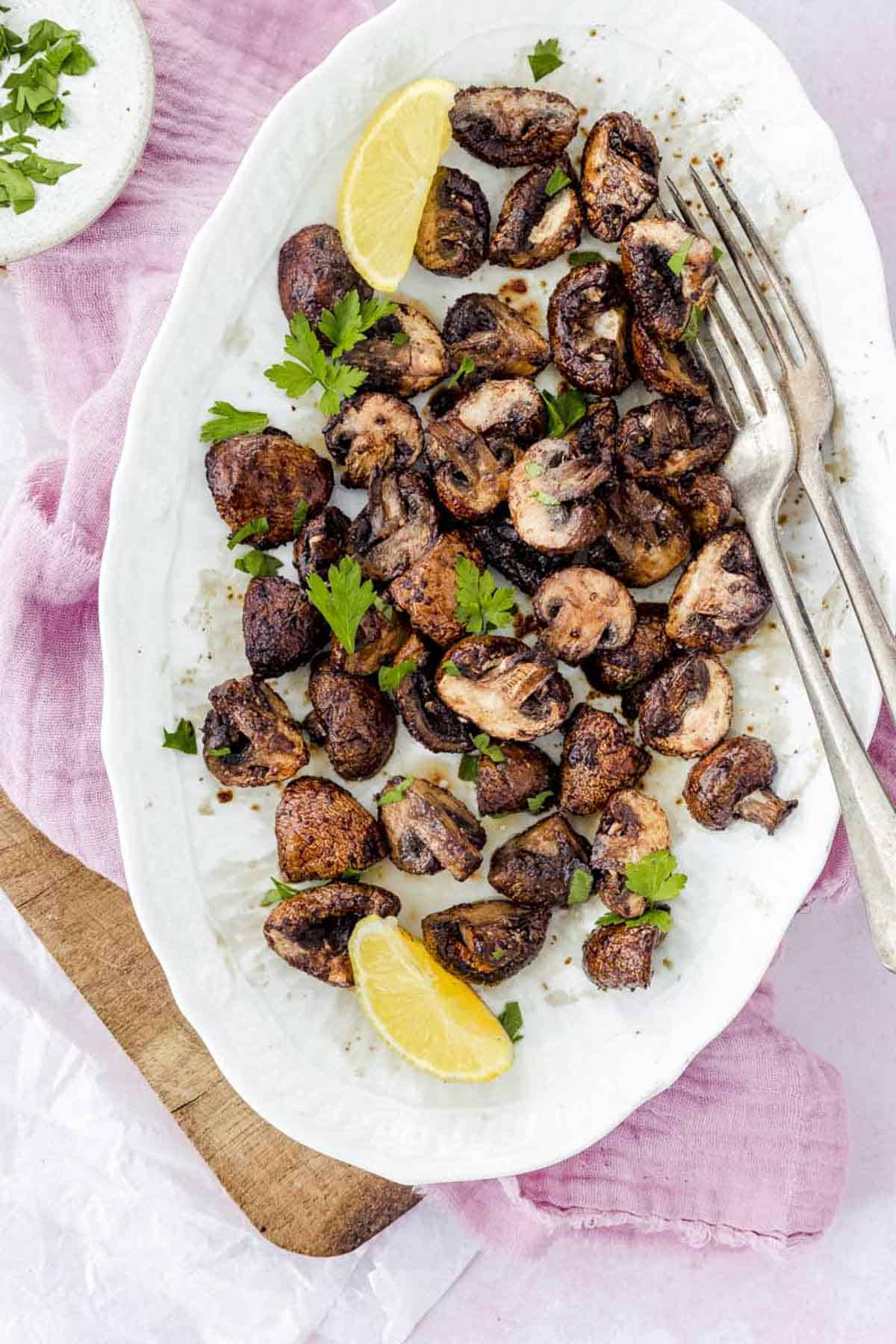 roasted mushrooms in a white platter.