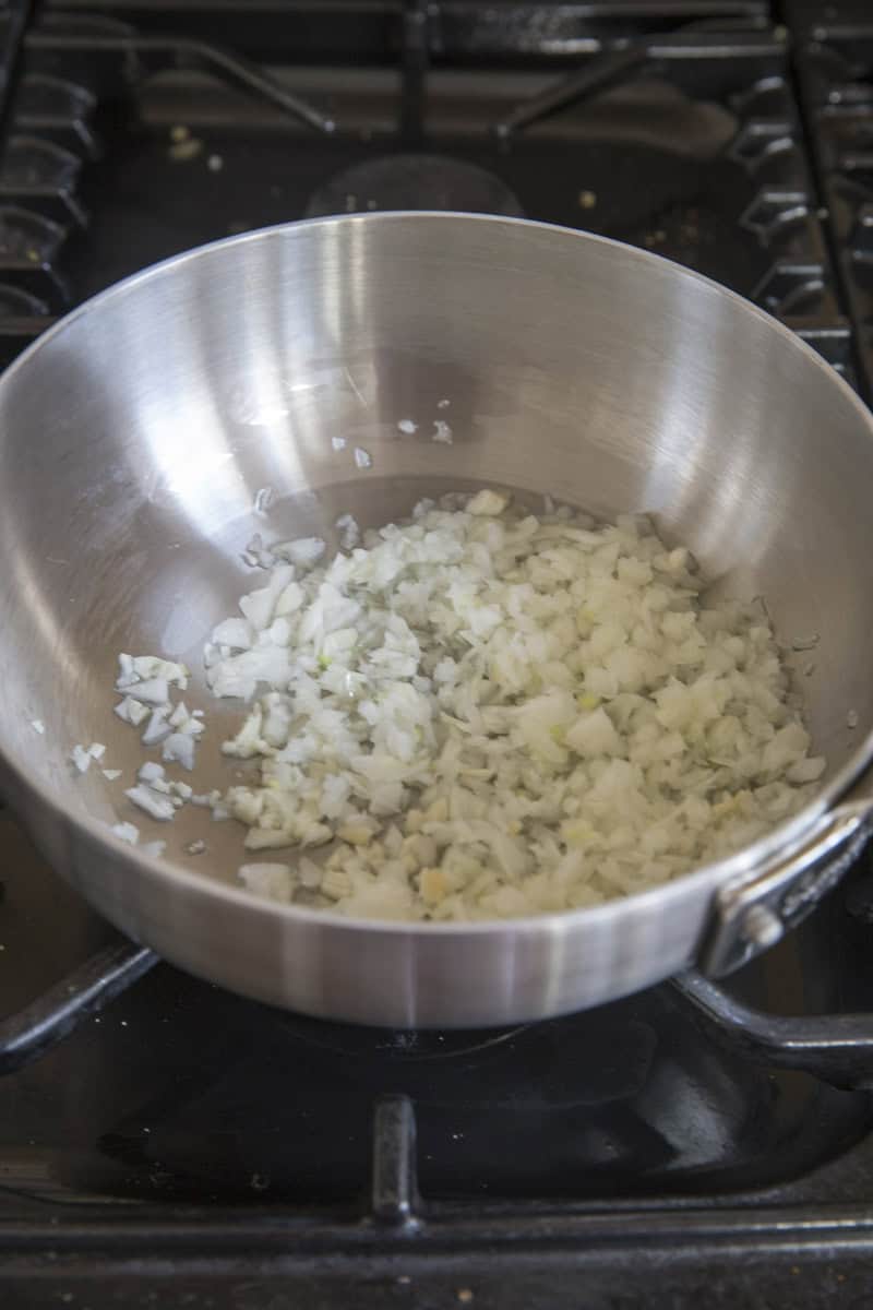cook onion and garlic in the pan.