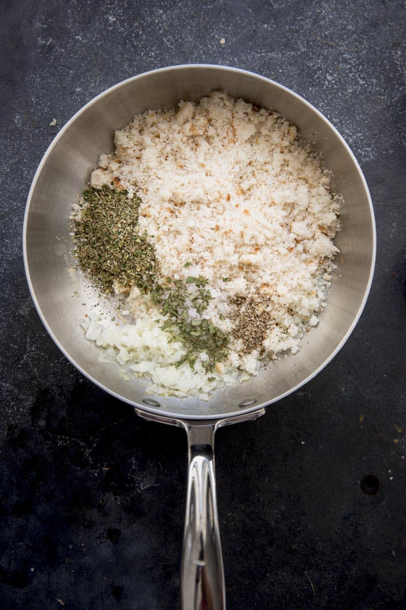 Add seasoning, chopped fresh sage, salt, pepper, and breadcrumbs.
