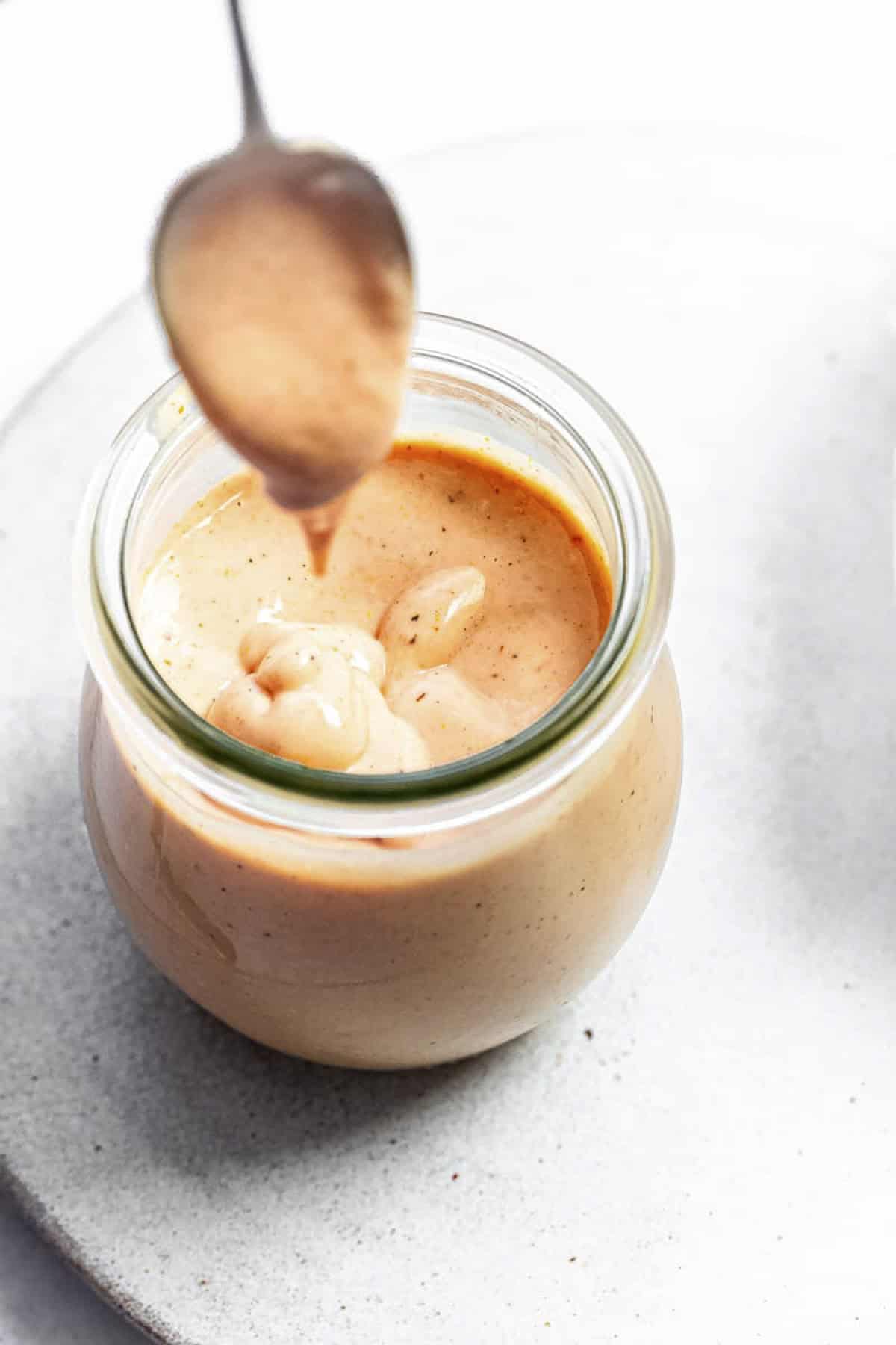 a spoonful of orangish dipping sauce.