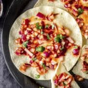 red onion chutney served on poppadoms.