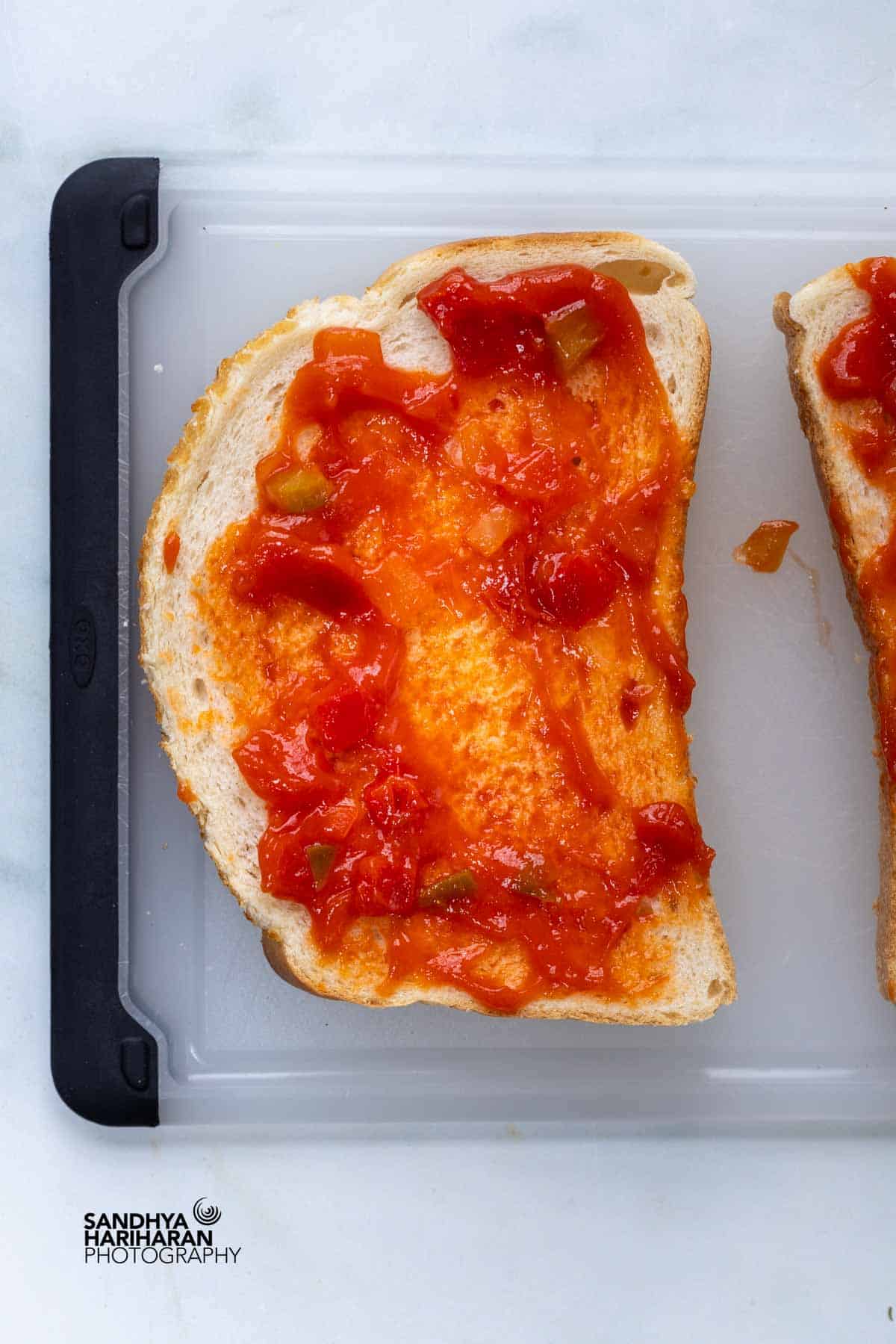spread the tomato salsa over the bread.