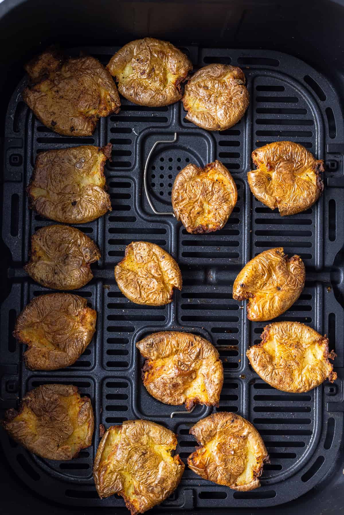 Air fried mashed potatoes in the air fryer basket