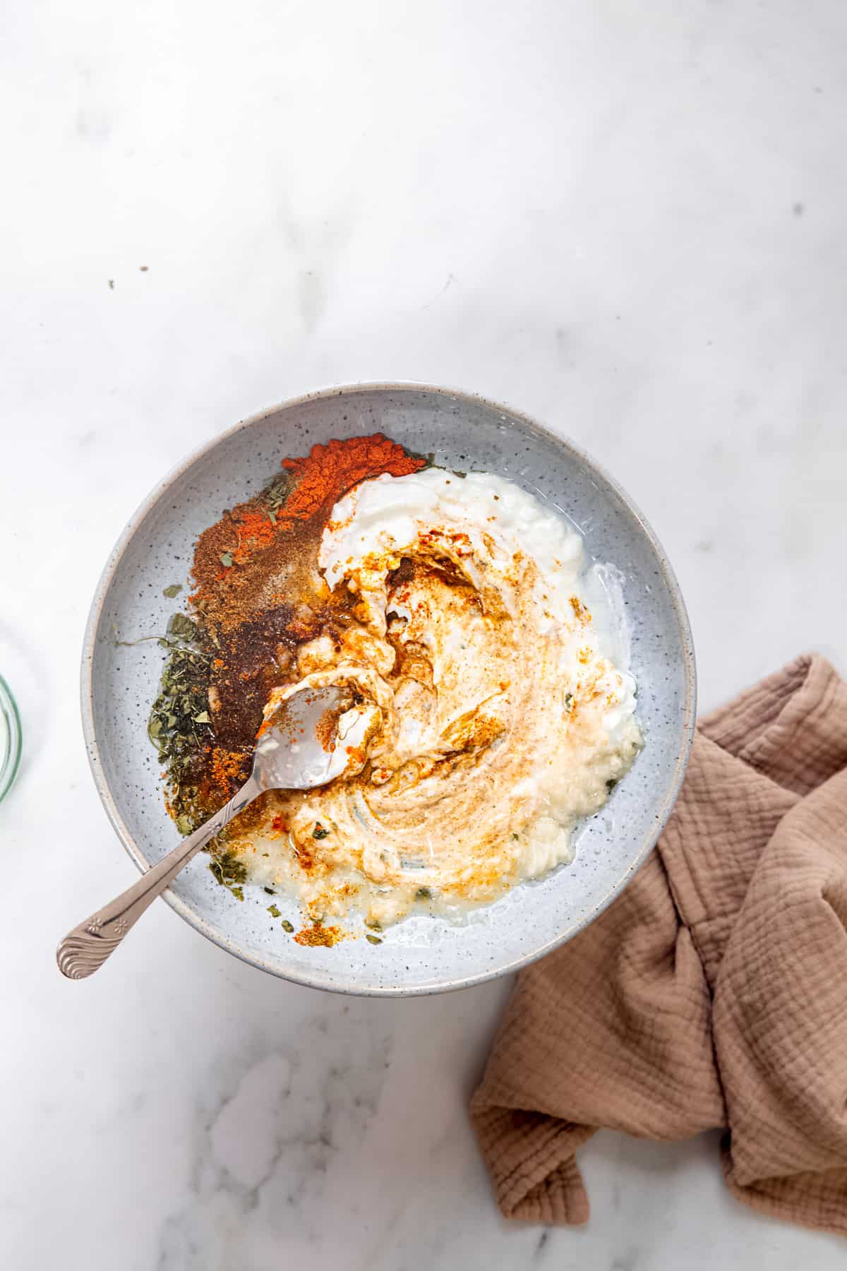 Ingredients for making Indian marinade in a bowl.