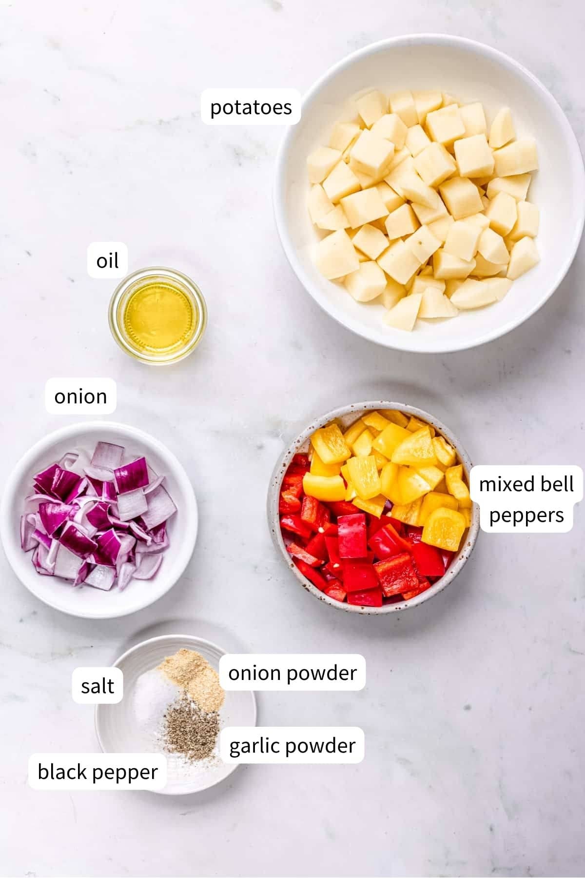 ingredients for breakfast potatoes with onion and peppers.