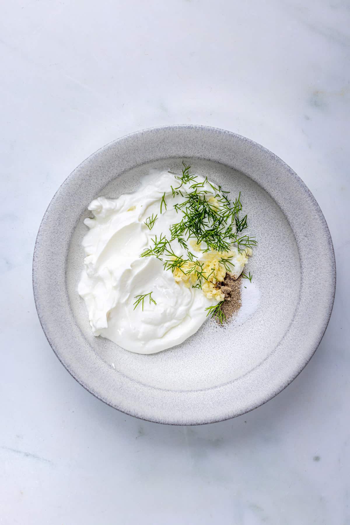 add the ingredients for the dill yogurt sauce into the bowl