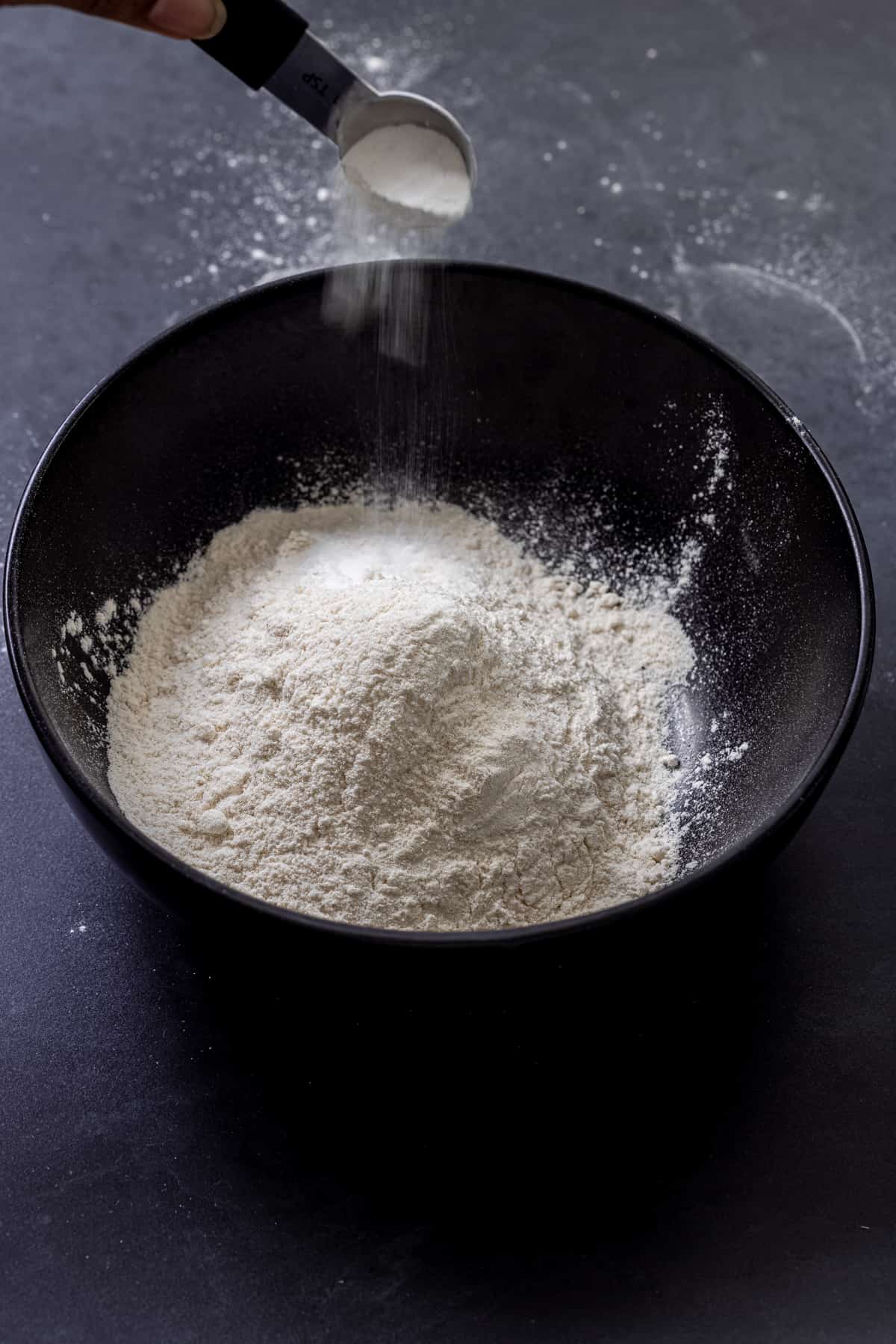 adding baking powder to plain flour to make self raising flour at home.