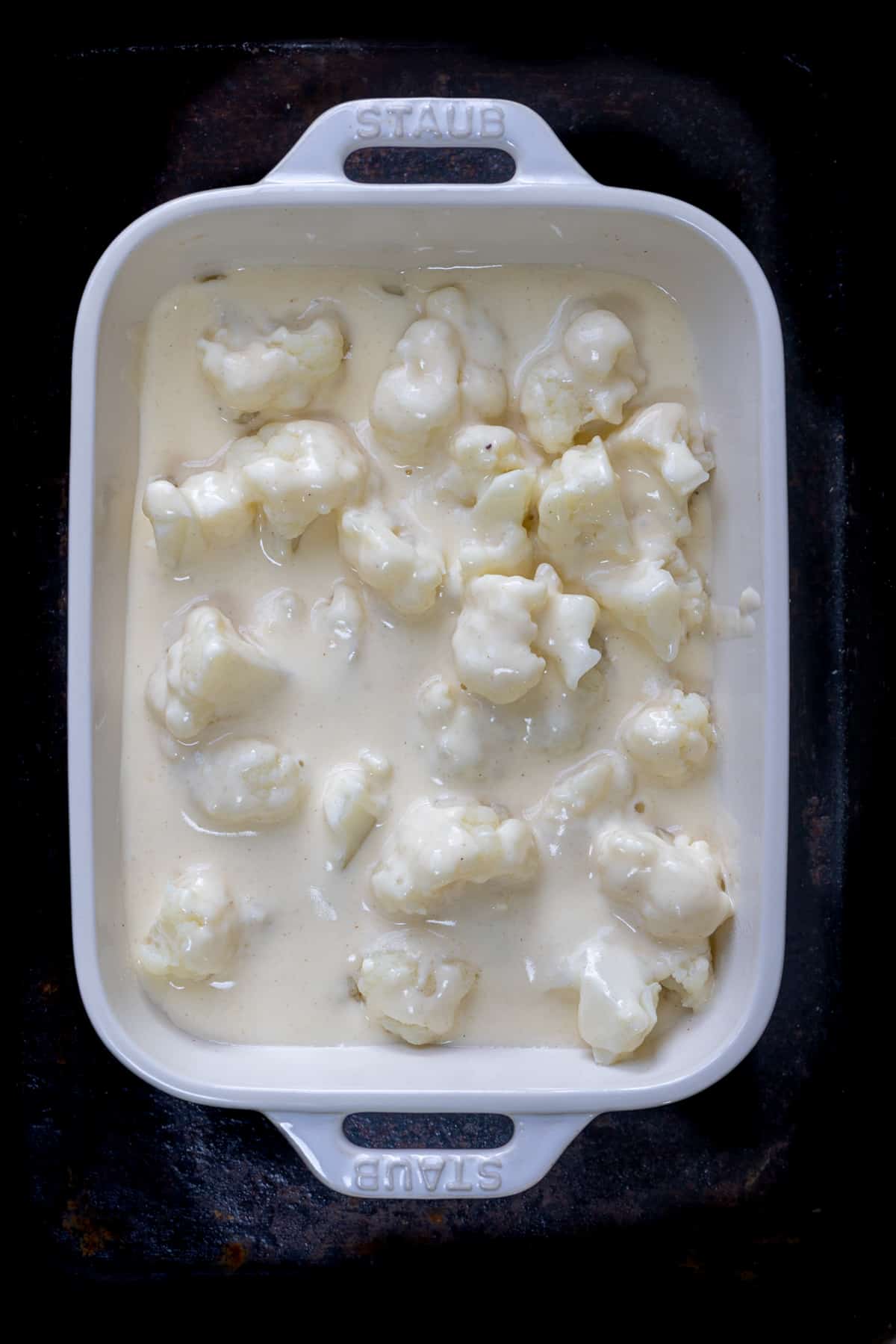 add the cauliflower and the white bechamel sauce.