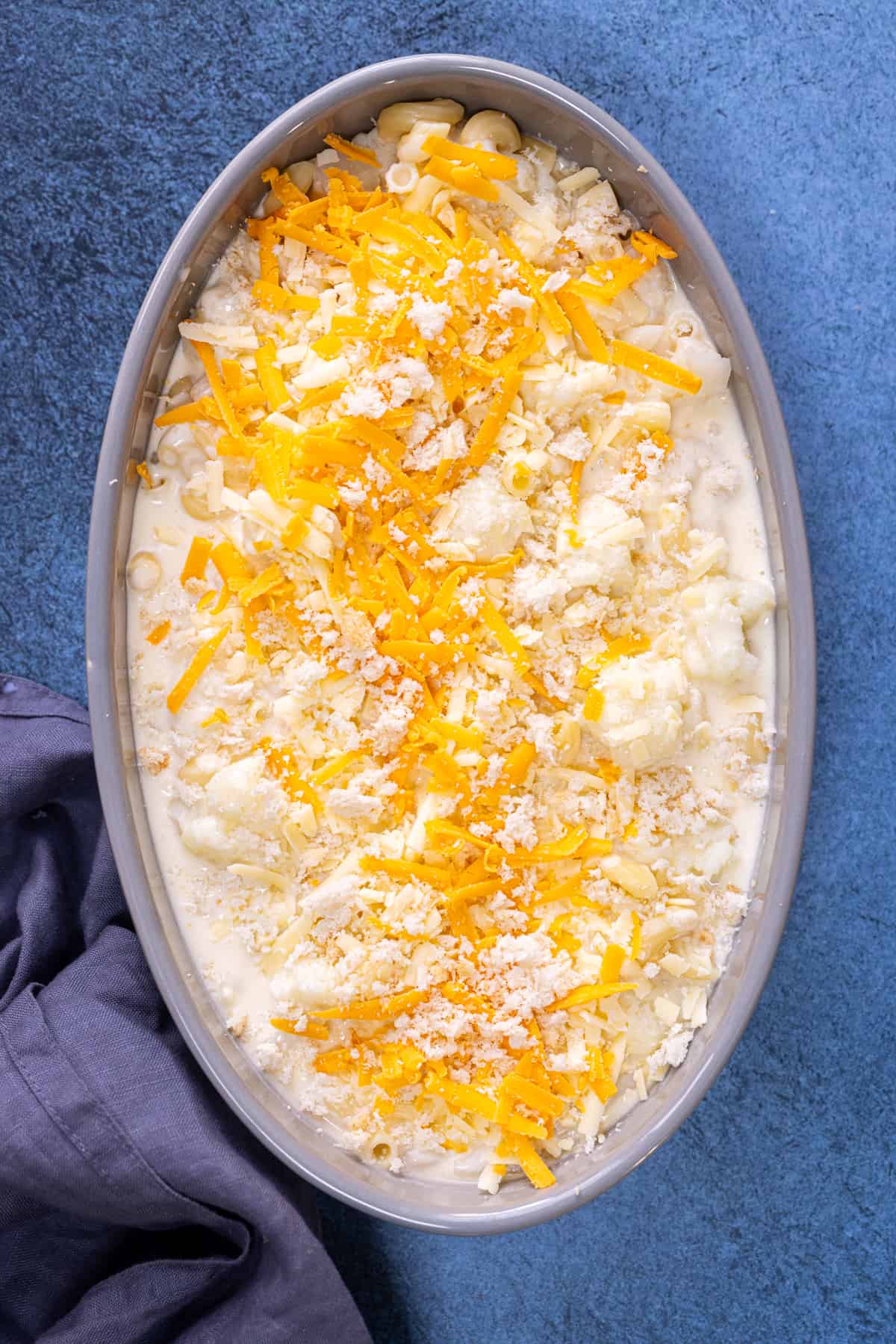 add the cheese and cheese sauce over the caulflower and macaroni.