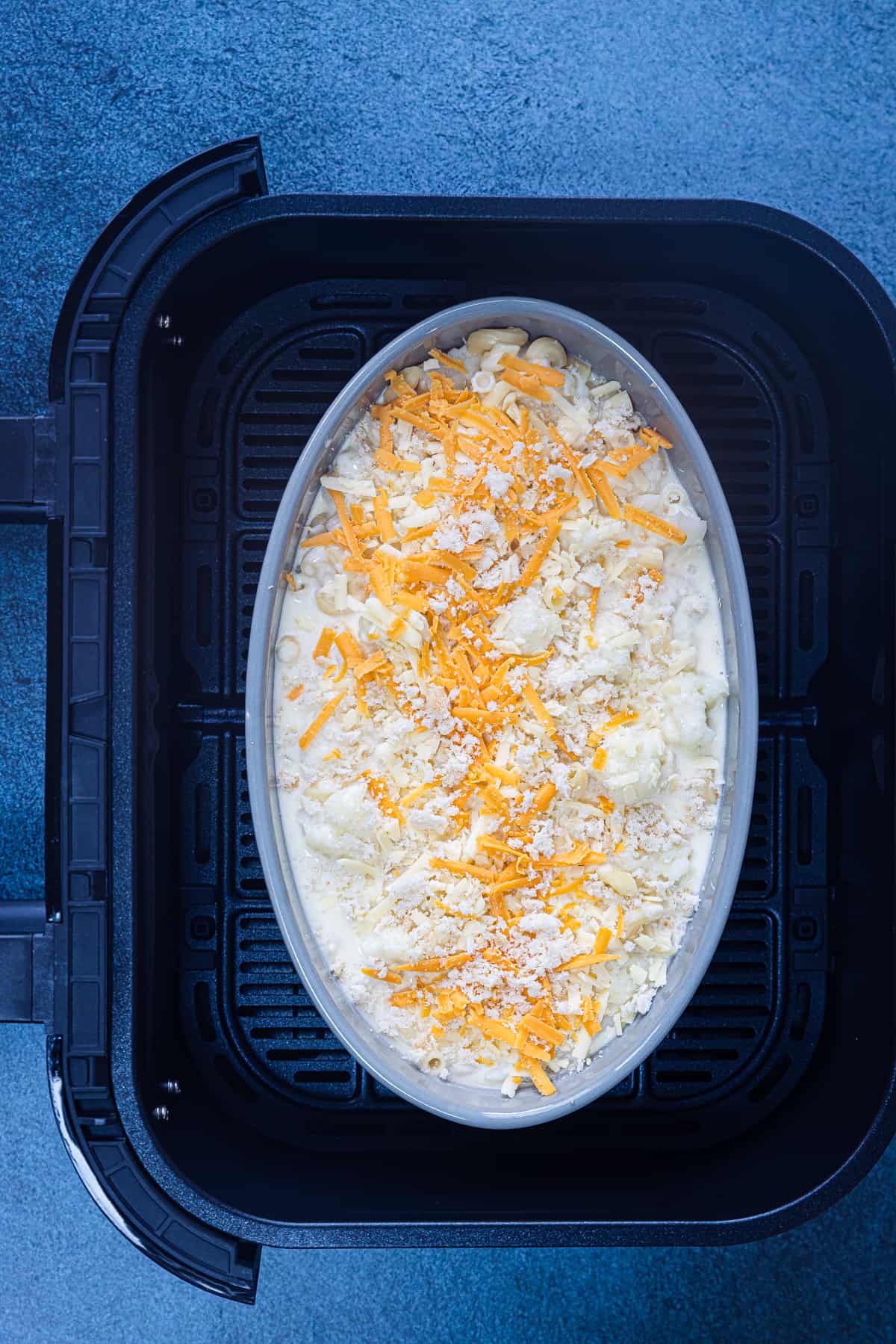 place the cauliflower mac and cheese in air fryer basket.