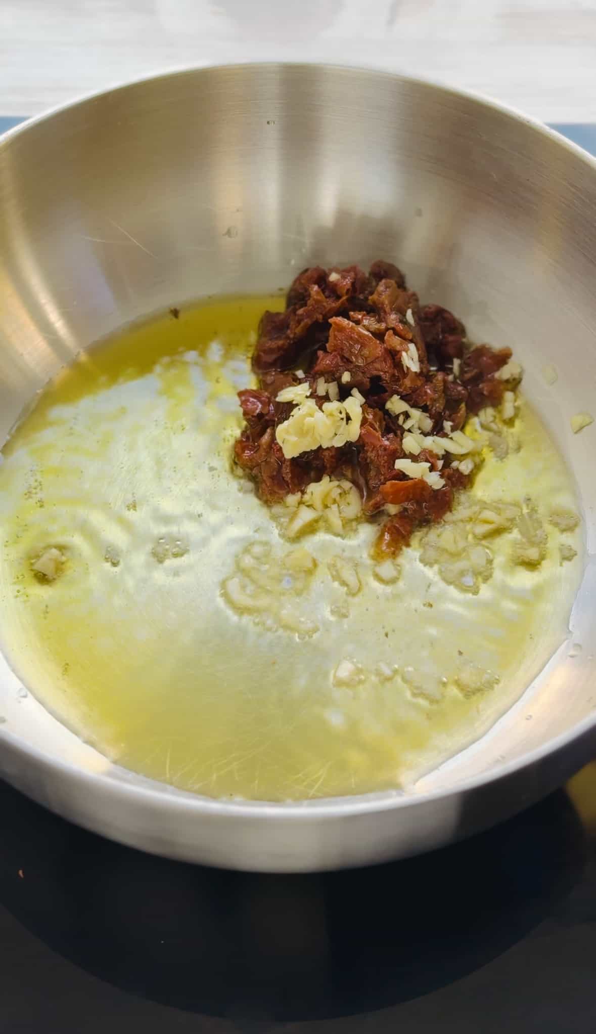 cook sun dried tomatoes, garlic in oil.