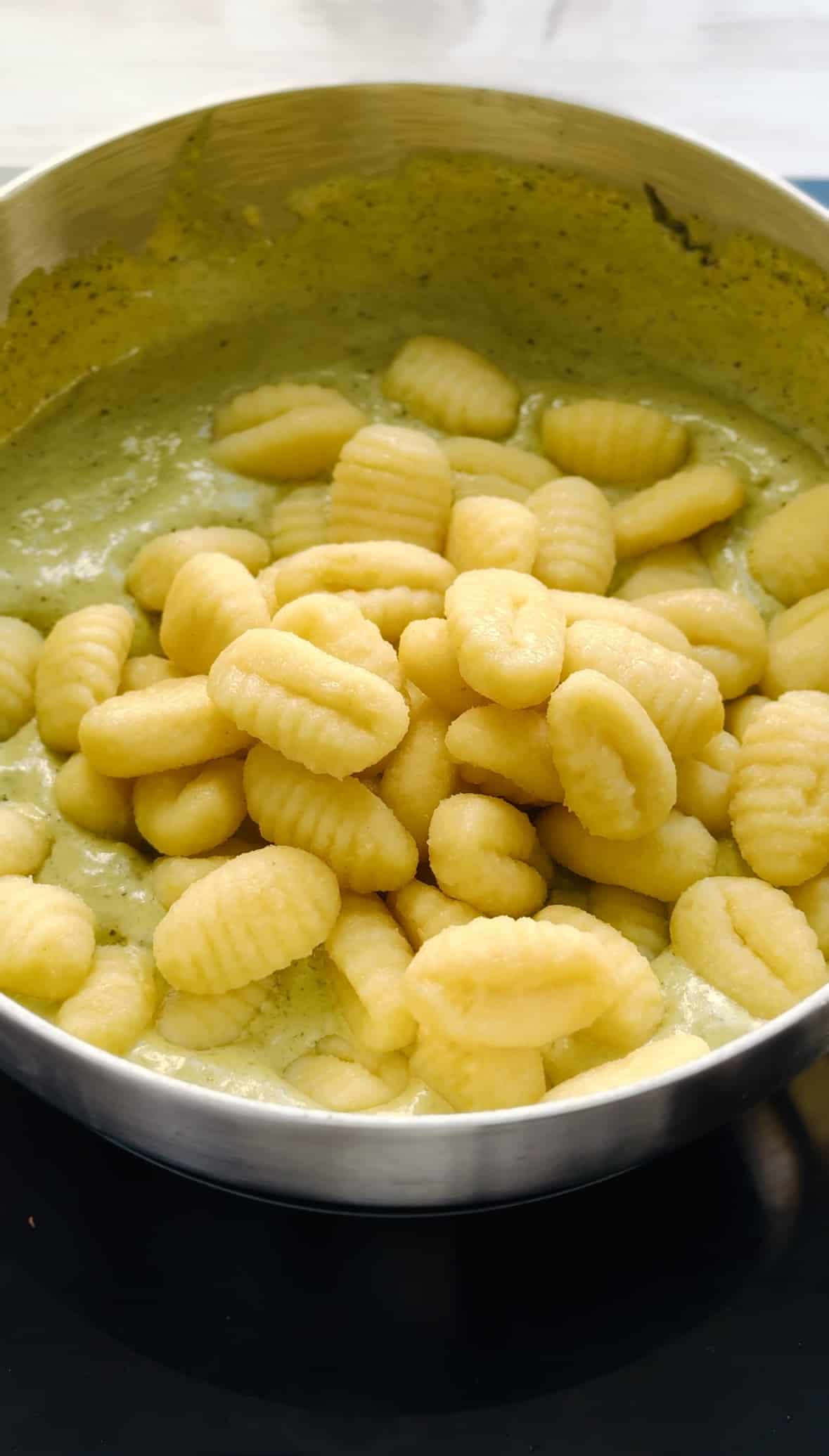 add gnocchi to the creamy pesto sauce.