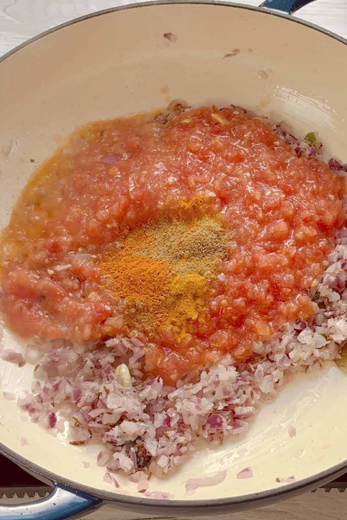add tomatoes for making the base masala for the curry.