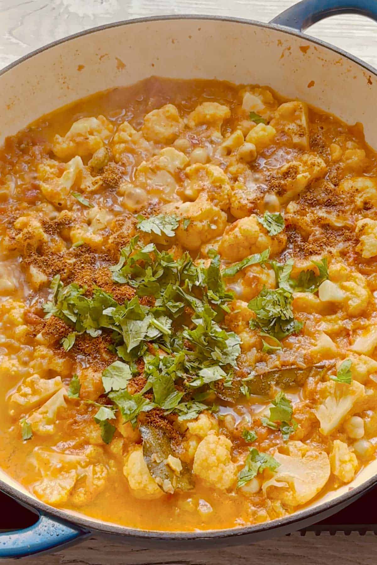 finish with coriander leaves over the chickpea and cauliflower curry.