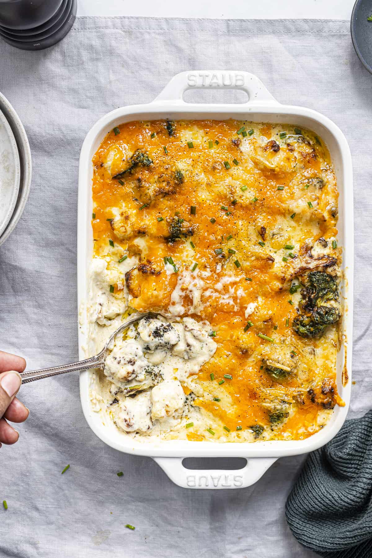 roasted broccoli and cauliflower cheese in a casserole dish