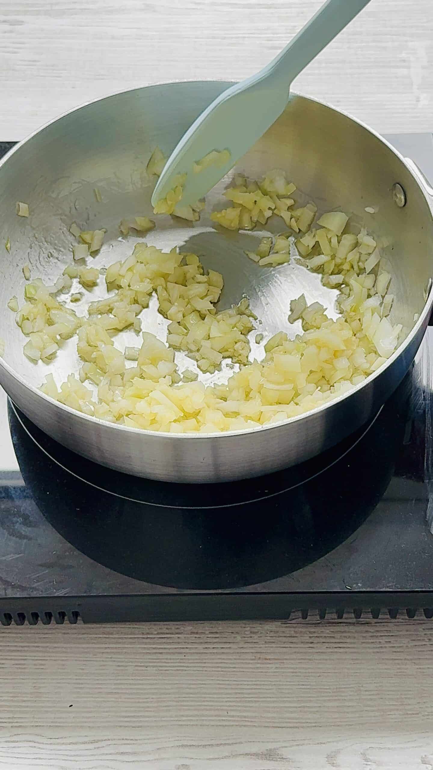 fry onions in a pan to make Italian marry me chickpeas.