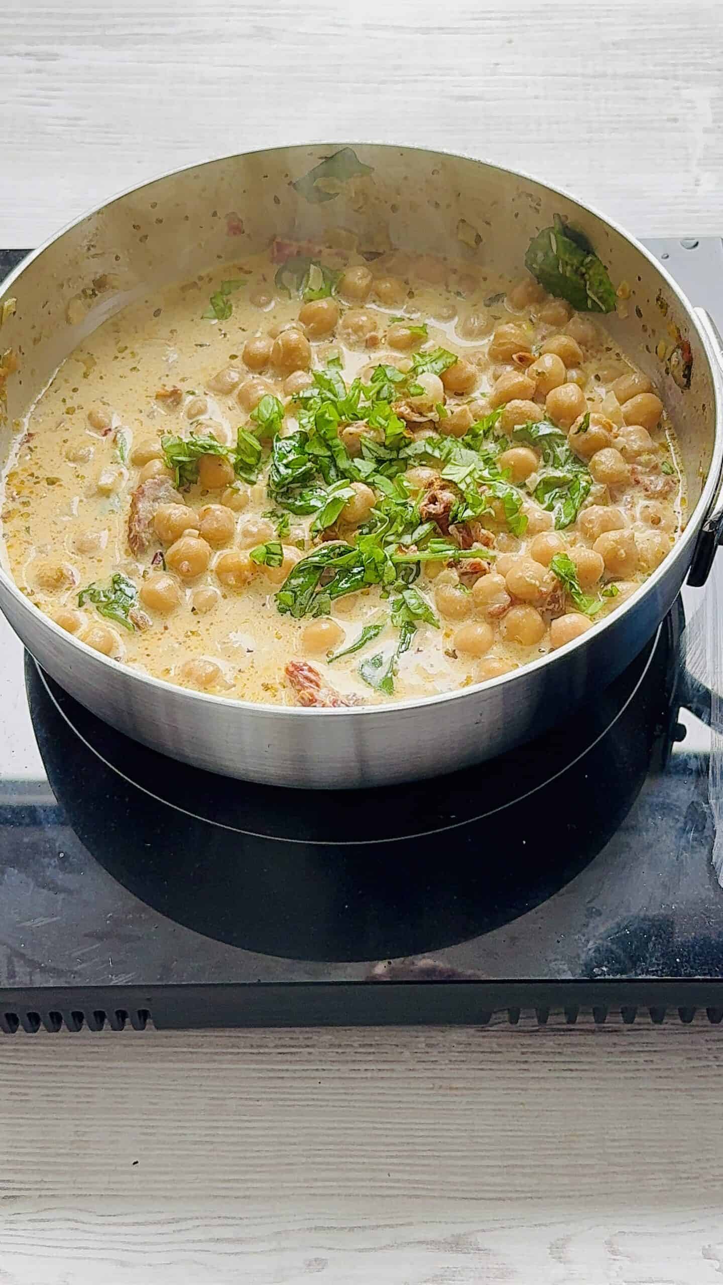 finish the Italian creamy chickpeas with basil.