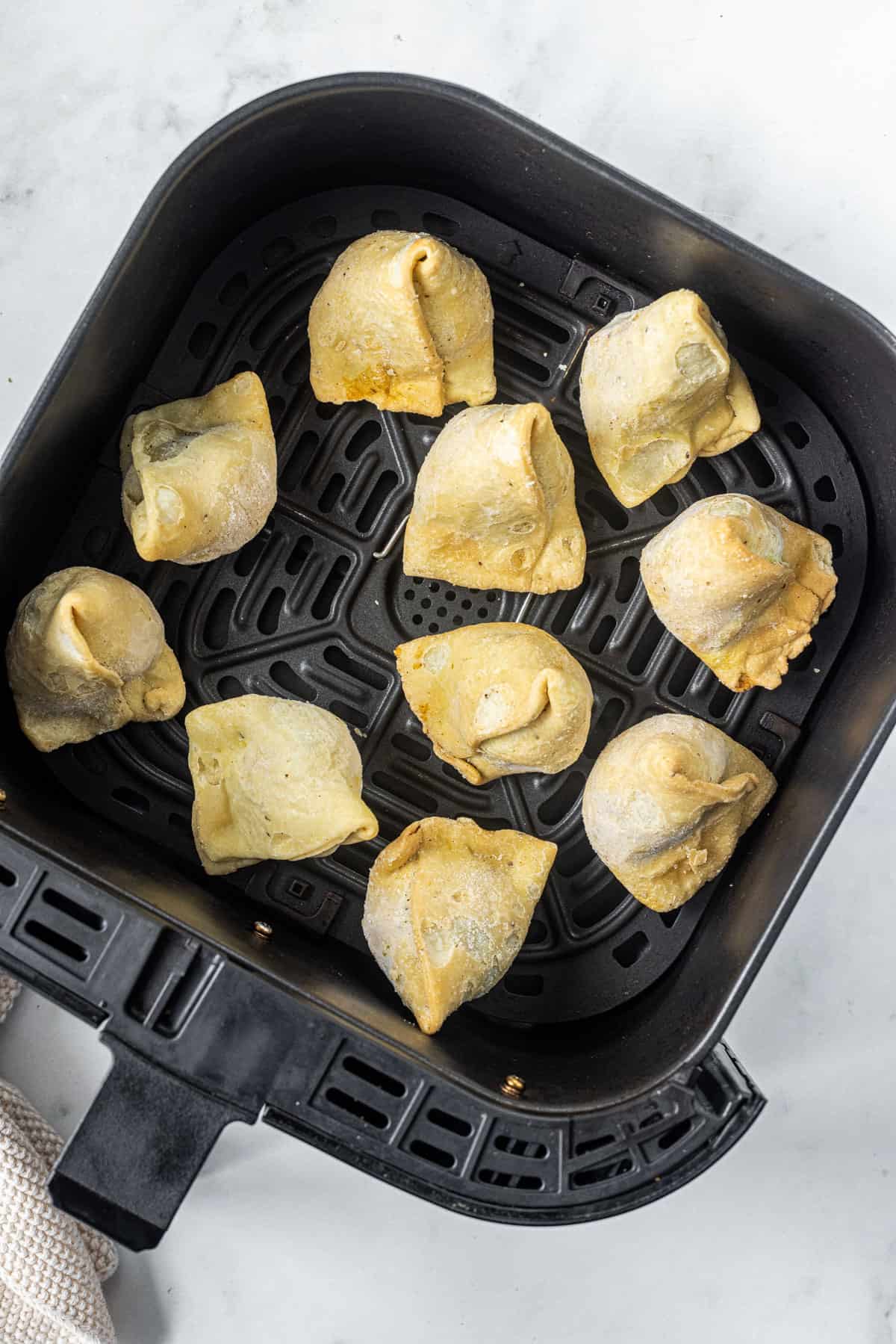 frozen samosa in air. fryer basket