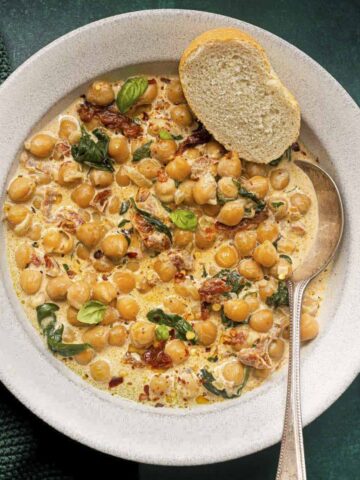 marry me chickpeas served with garlic bread in a bowl