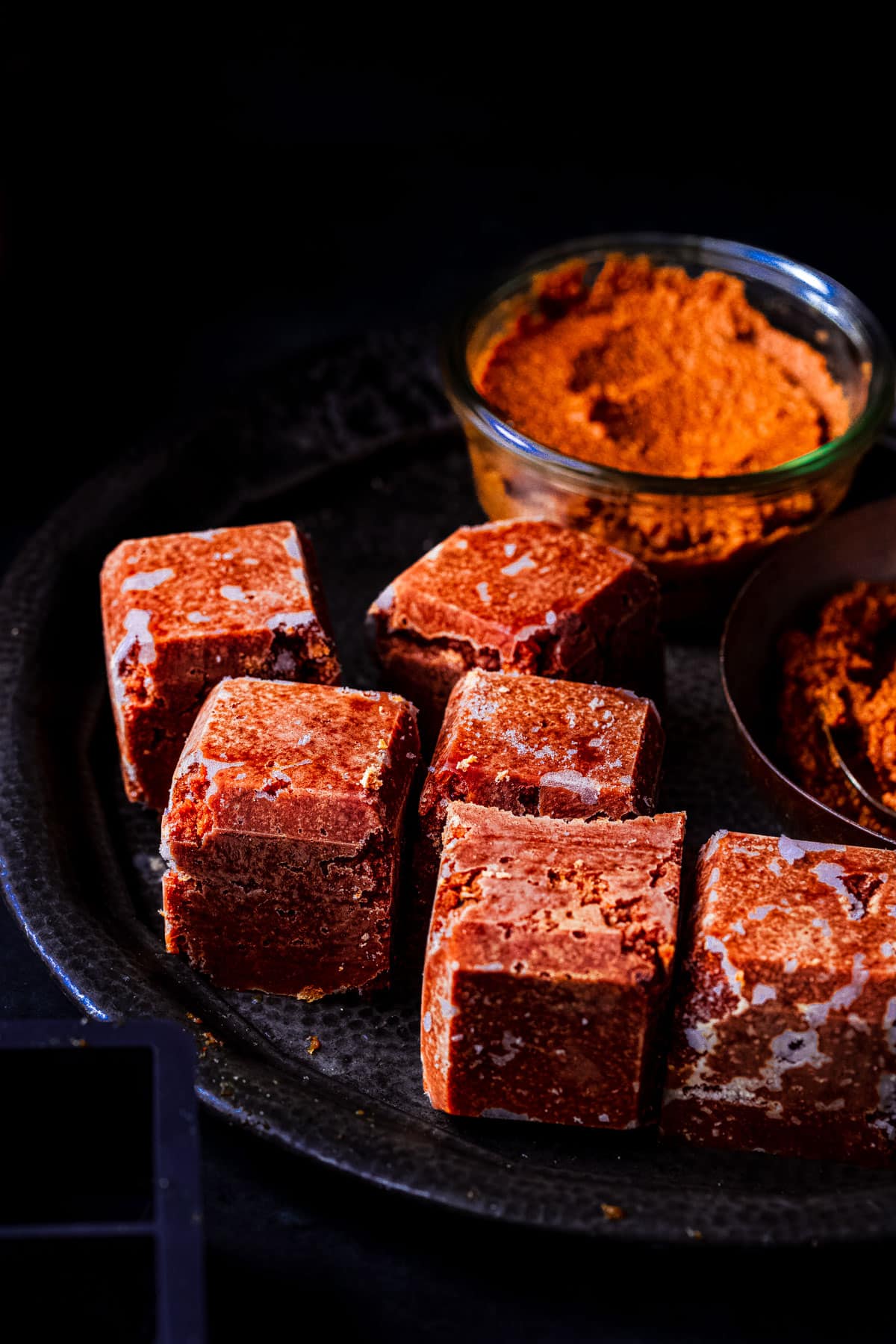 6 freezer curry sauce cubes and a jar of curry sauce.
