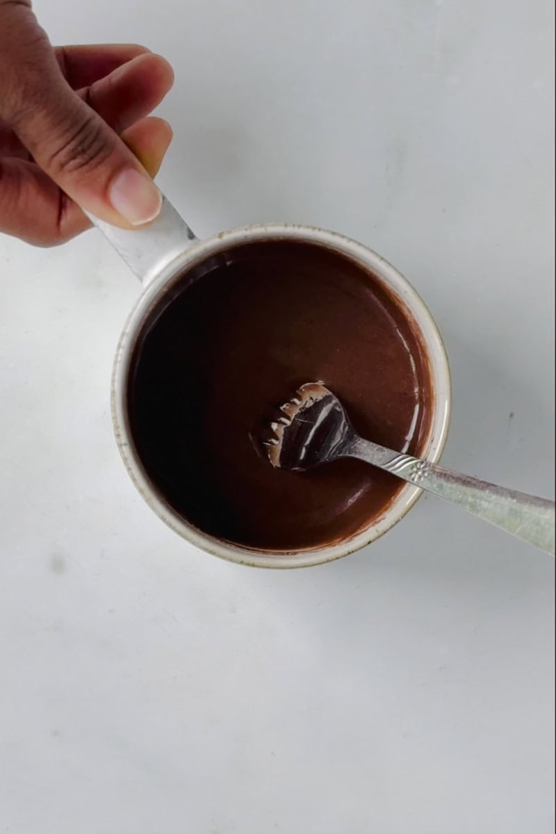 wet chocolate cake batter in the mug.