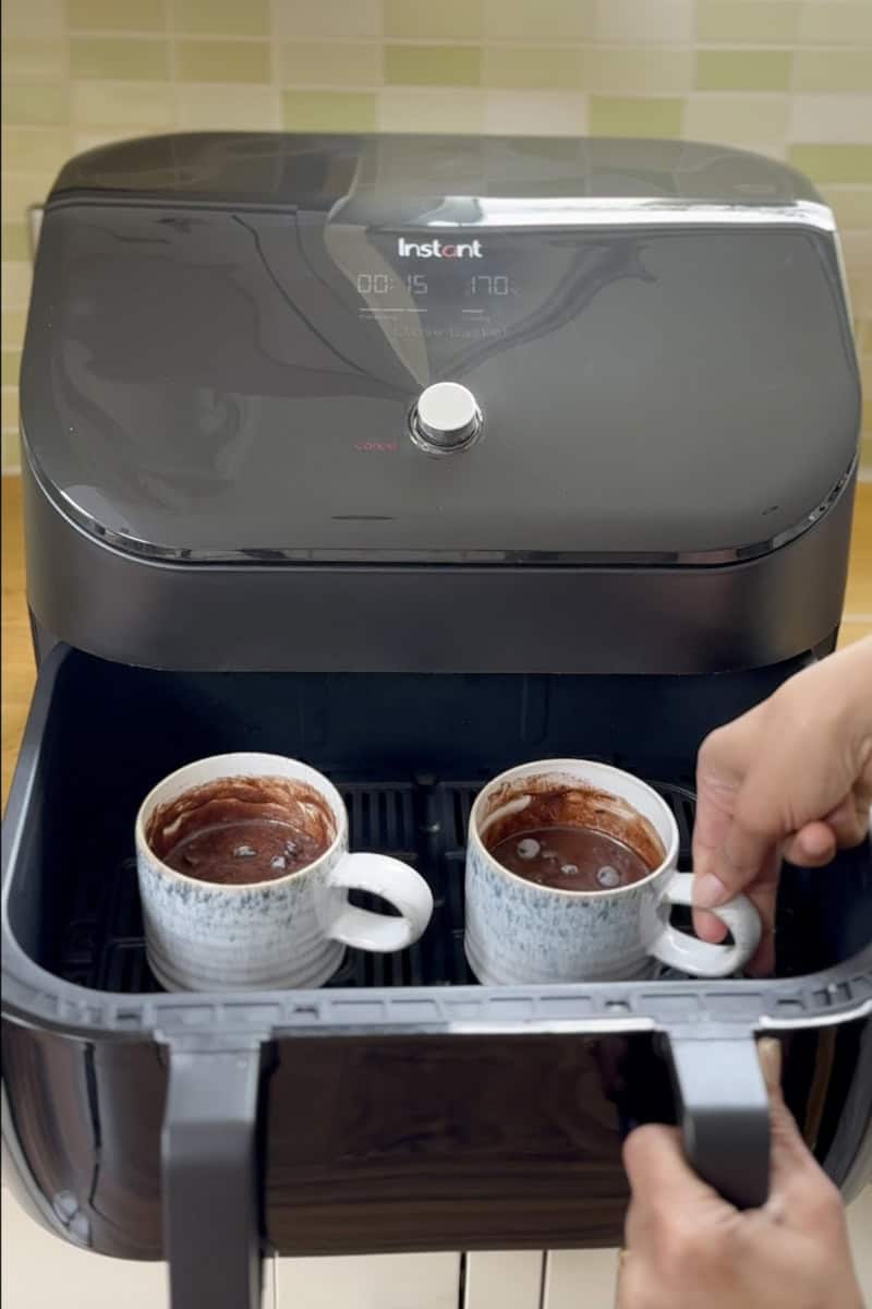 place the mug cake inside the air fryer basket.