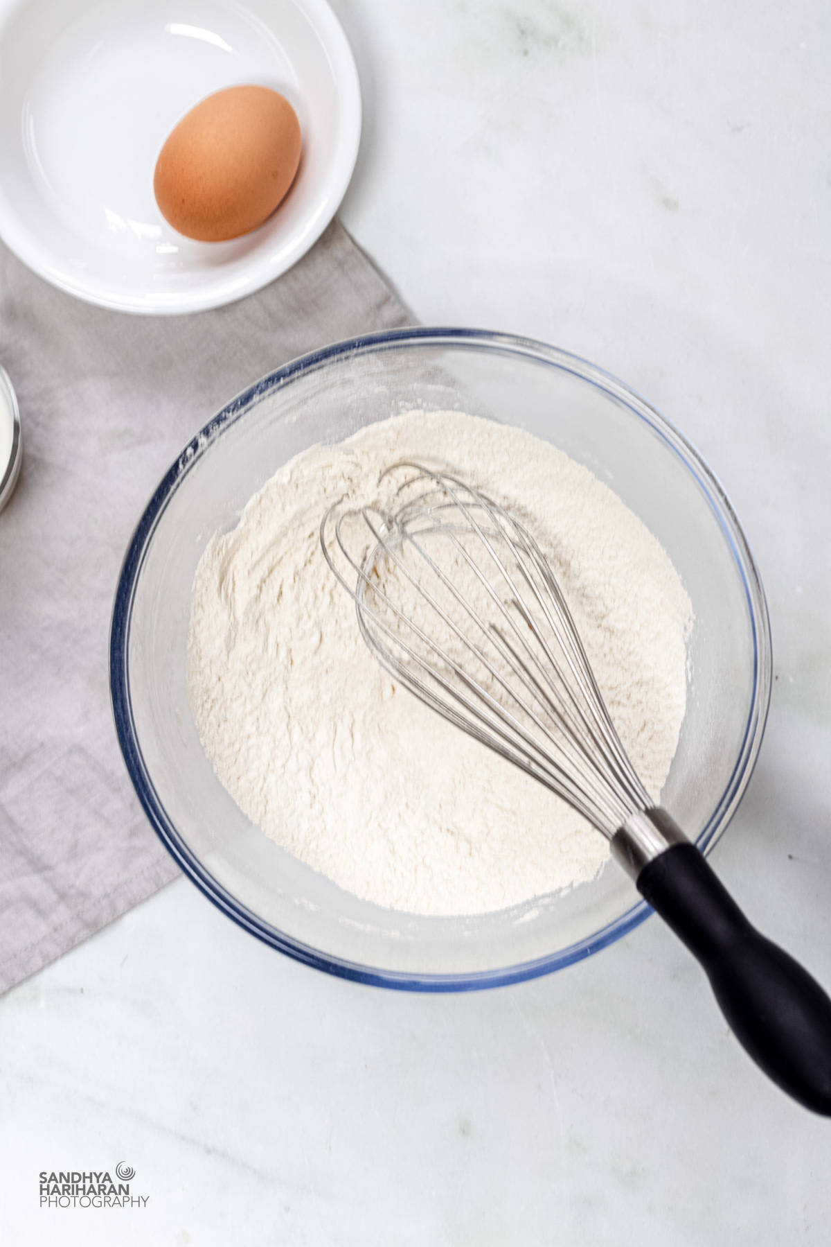 dry ingredients in bowl with a whisk.
