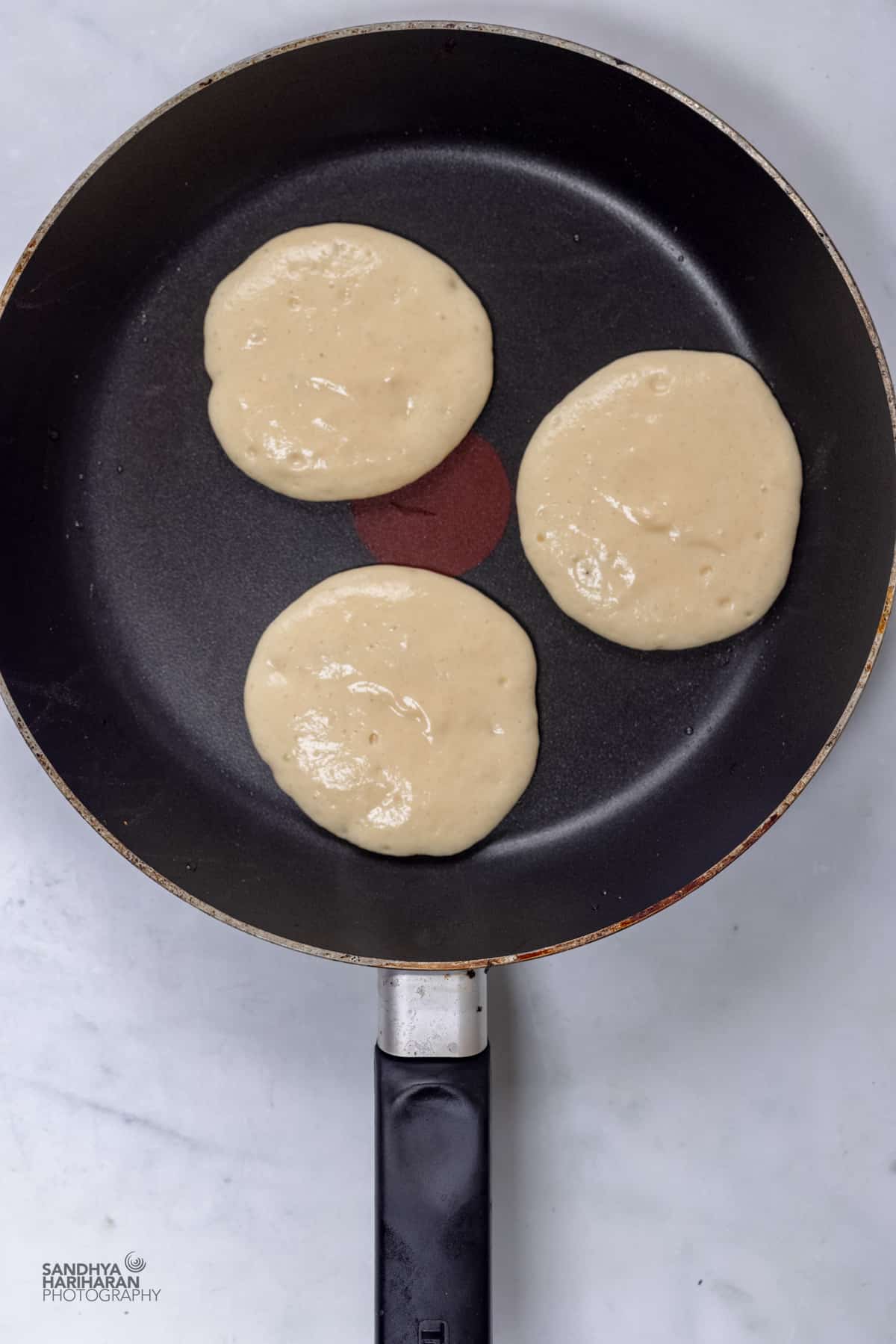 pancakes ready to cook on a skillet.