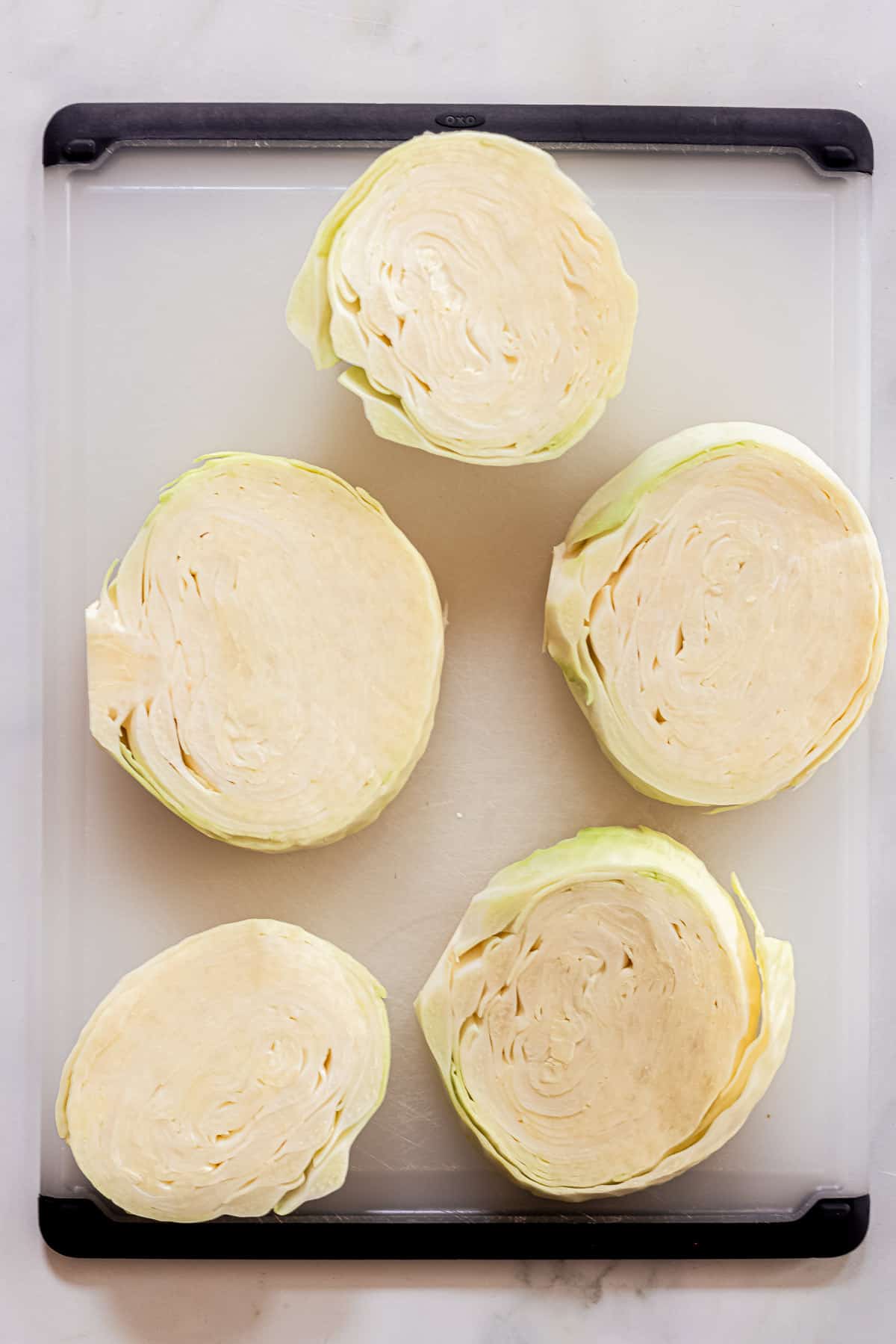 sliced cabbage on a chopping board.