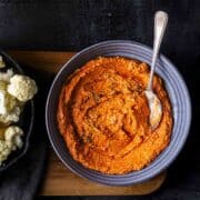tandoori sauce marinade in a bowl and cauliflower