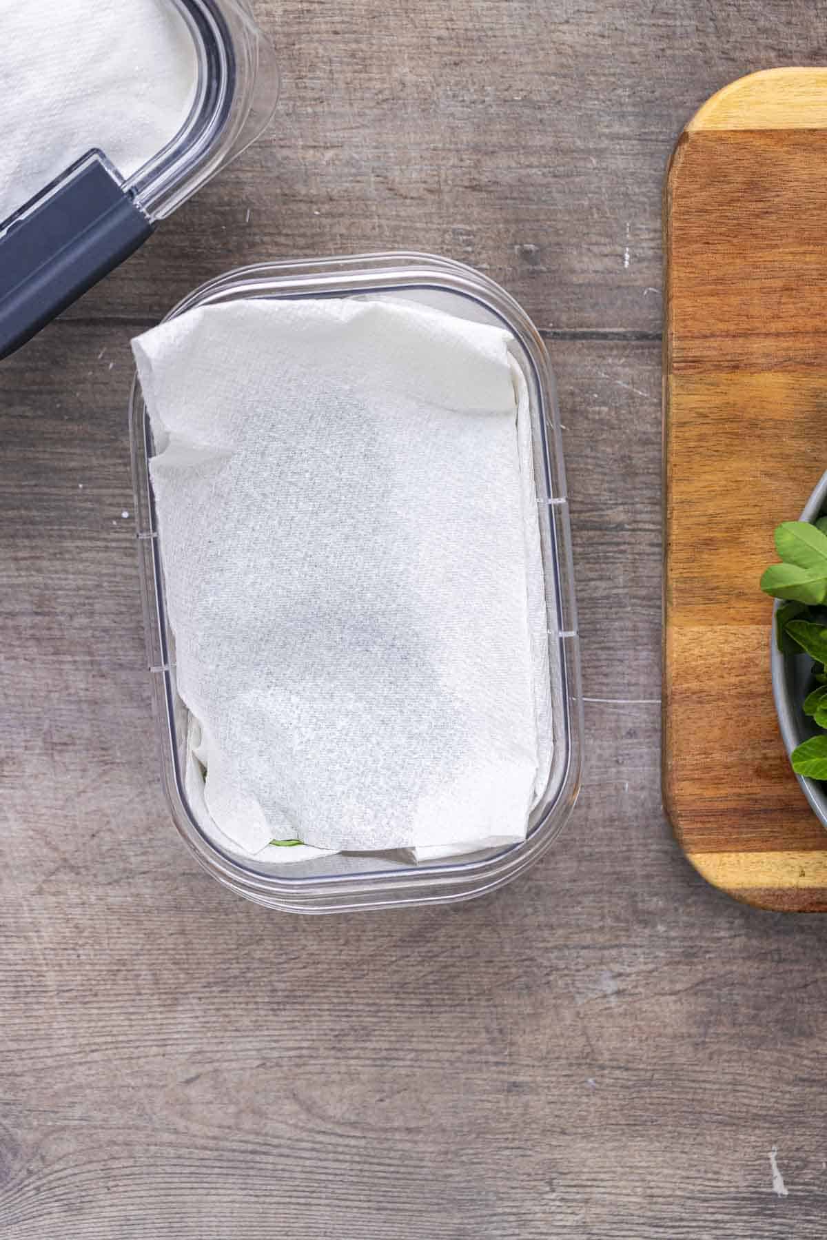 Cover the leaves with another paper towel.