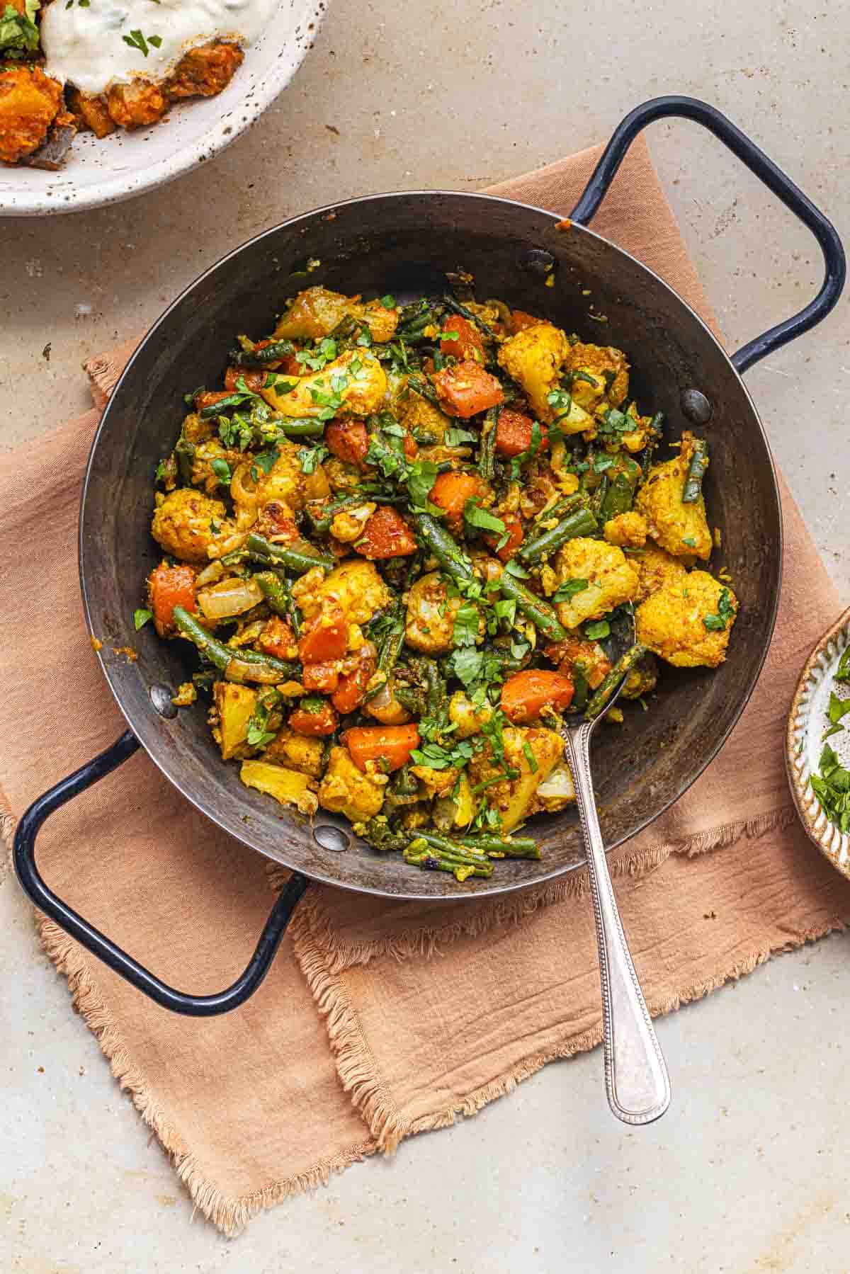 mixed veg curry in a pan.