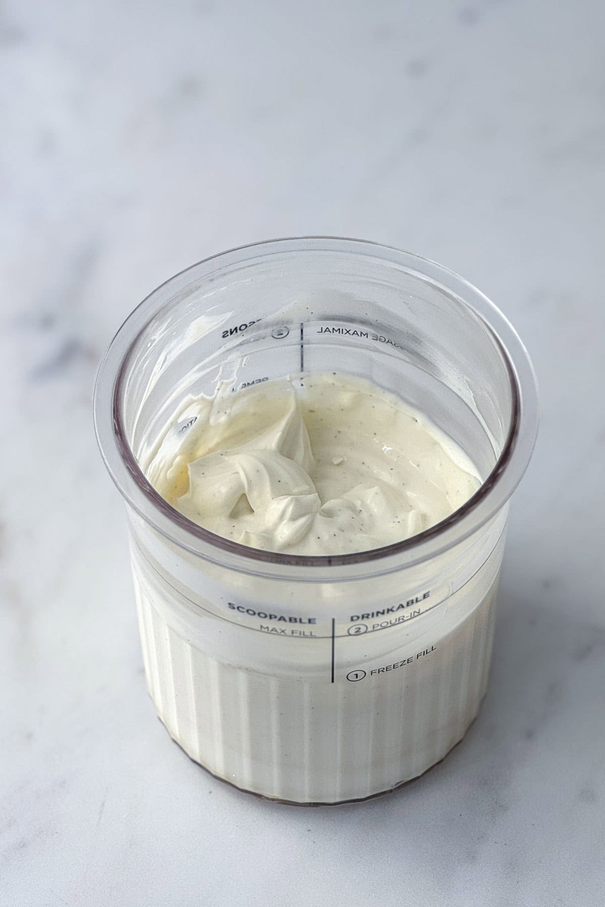 ninja creami frozen yogurt ingredients in the pint tub.