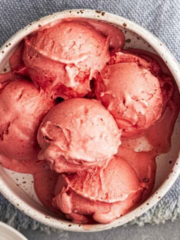 Ninja Creami Strawberry Ice cream scoops in a white bowl.